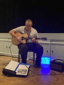 Parkinson's and Music Therapy - Photo of the author playing guitar in front of the exercise class.