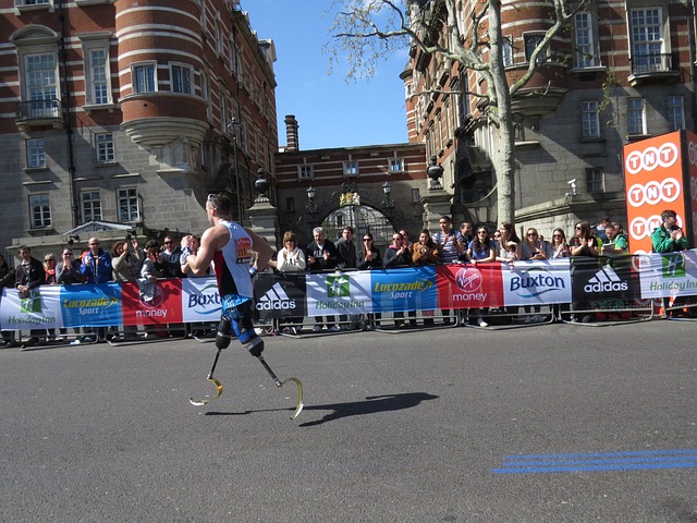 Parkinson's and Optimism - Photo of a man with Prosthetics running a road race to reinforce the concept of resiliency