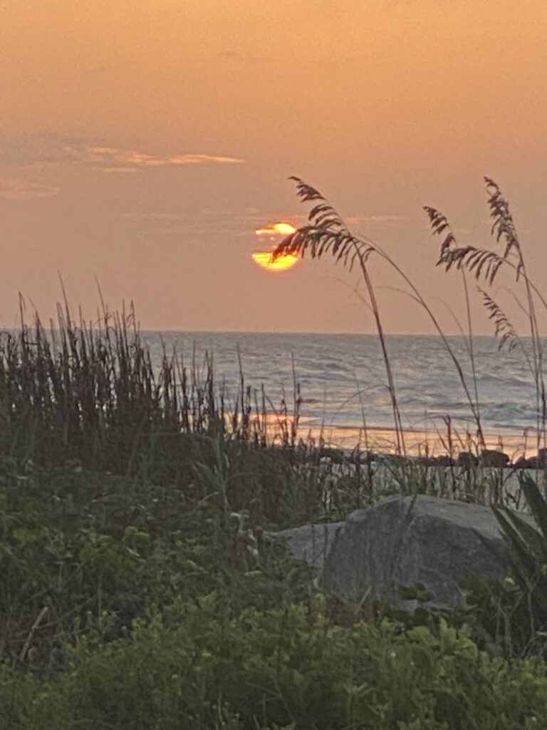 Parkinson's Challenges - a photo of the beach at sunrise to emphasize a new day