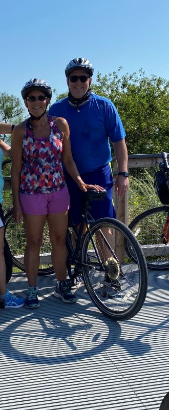 Photo of my Wife Mary and I bicycling in Delaware